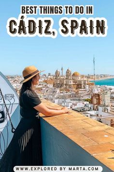 a woman standing on top of a roof with the caption best instagram spots in cadiz, spain