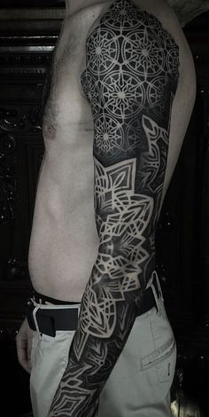 a man with a tattoo on his arm