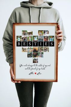 a woman holding up a framed photo with the words besties on it and photos