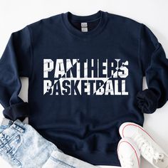 a sweatshirt with the word panther's basketball printed on it next to shorts and sneakers