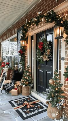 a front porch decorated for christmas with wreaths and presents