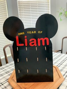 a mickey mouse birthday card with the word'one year of lam'on it