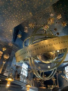 the inside of a building with stars on the ceiling and chandelier hanging from the ceiling