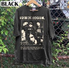 a t - shirt hanging on a fence with the words tokio hotel printed on it