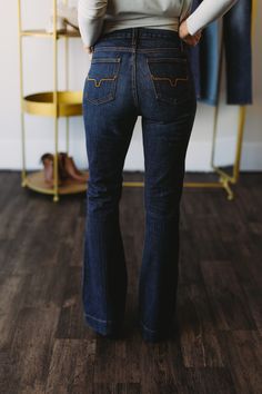 Top of the line, premium denim, proudly made in the U.S.A. Dark wash denim with whisker wash hand sanding. Kimes "horns" light copper back pocket stitch. Thick quality woven denim that holds you in smooth and snug without digging in at the waist band. 11.5" high rise, based on a size 6. Rise will be slightly lower for smaller sizes and slightly higher for larger sizes. Rise sits slightly higher in the back. Uniquely designed waistband gives enough to conform to your body so that it's forgiving. Ariat Jeans, Western Life, Light Copper, Slim Trousers, Dark Wash Denim, Trouser Jeans, Premium Denim, Size 00, Waist Band