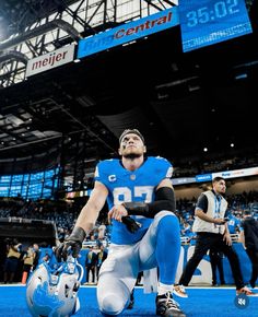 a football player kneeling down on the field