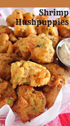 shrimp hush puppies with ranch dip in the middle on a red and white checkered tablecloth