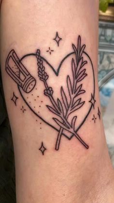 a heart shaped tattoo with two crossed swords in the center and an arrow on it