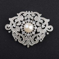 *Victorian American Diamond & Fresh Natural Pearl Handmade Brooch, 925 Sterling Silver Purity Brooch, Wedding/Engagement Brooch **Product Details :-- *Gemstone :-- American Diamond (CZ) & Fresh Pearl *Gemstone Weight :-- 6.80ct Zircon & 4.25ct Pearl *Metal -- 925 Sterling Silver *Silver Wt. -- 25-30gm *Finishing : Platinum Plated Over 925 Silver *This is very Beautiful & Pretty Brooch. Everyone Can be gifted it For His/Her Mother and Daughter. ▶ Want to find out more? Check out my shop https://w Brooch Wedding, Antique Brooches, Natural Pearl, Brown Diamond, Pearl Gemstone, Brooches Handmade, American Diamond, Pearl Diamond, Natural Pearls