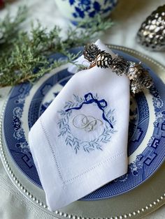 a blue and white plate topped with a napkin