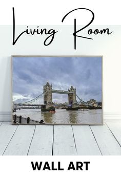 the living room wall art is displayed on a wooden floor