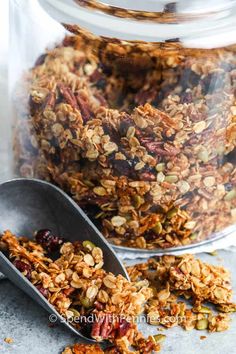 granola mix in a glass jar with spoon