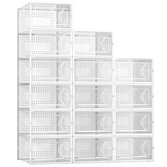 several white shelves stacked on top of each other in front of a white wall with holes