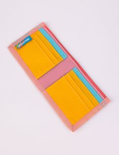 This rad wallet is the perfect place to keep all of your money related objects! Features 6 front-facing credit card slots with 2 extra hidden slots, a main cash pocket, color block detailing, and nylon binding. Shop all WalletsShop all Daydream Measures 9" wide x 4" tall unfolded, 4.5" wide folded.Water resistant 100% Coated Nylon Made in Los Angeles, California Retro Pink Wallet For Everyday Use, Everyday Multicolor Bifold Wallet, Bifold Multicolor Card Holder For Daily Use, Multicolor Bifold Card Holder, Multicolor Rectangular Rfid-blocking Card Holder, Multicolor Rfid Blocking Rectangular Card Holder, Multicolor Bifold Wallet For Everyday Use, Multicolor Rectangular Rfid Blocking Card Holder, Multicolor Rfid Blocking Card Holder For Everyday