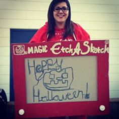 a woman holding up a sign that says happy halloween with the words magic etch shack written on it