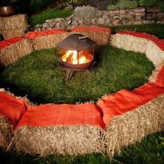 an outdoor fire pit made out of hay