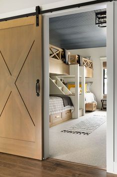 an open door leading to a bedroom with bunk beds