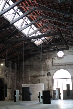 an empty room with lots of light coming through the roof and windows on the ceiling