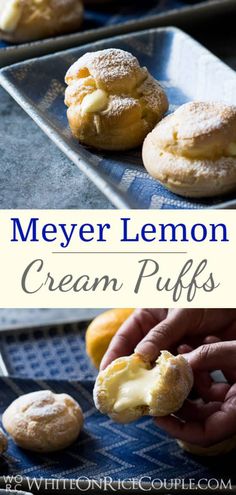 lemon cream puffs with powdered sugar on top and in the foreground, there is a hand picking one