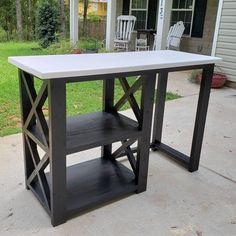 a white table sitting in front of a house