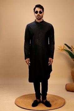 Black asymmetric hemline silk kurta. Paired with a churidar. - Aza Fashions Fitted Slub Silk Kurta For Eid, Black Semi-formal Kurta For Festive Occasions, Black Silk Kurta For Festivals, Straight Cotton Silk Kurta With Dabka, Straight Kurta In Cotton Silk With Dabka Detail, Black Cotton Silk Kurta For Festivals, Black Silk Kurta For Diwali, Black Cotton Silk Long Sleeve Kurta, Black Long Sleeve Cotton Silk Kurta