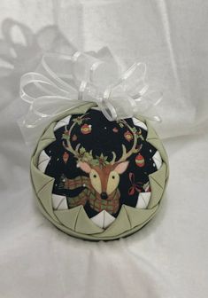 a ceramic ornament with a deer head on it