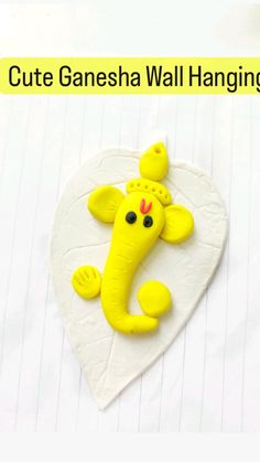 an elephant is sitting on top of a heart shaped object with the words cut ganesh wall hangings