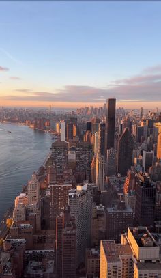 an aerial view of new york city at sunset