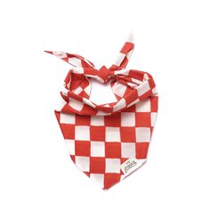 a red and white checkered bandana with a knot on the end, sitting in front of a white background