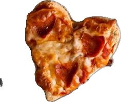 a heart shaped pizza sitting on top of a table