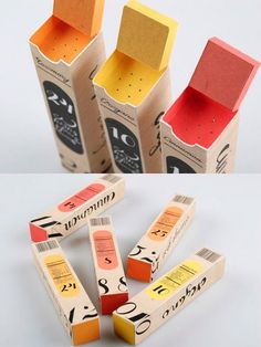 four different colored boxes with numbers on them and one is open to reveal the inside