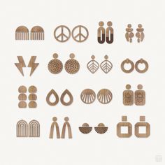 various wooden earrings and earring designs on a white background with the word peace written in large letters