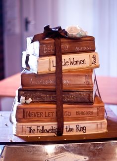 a stack of books sitting on top of a table