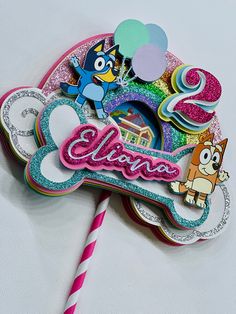 there is a cake topper that says glamo on it with a cat