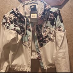 New With Tags!! Has Sort Of A Shiny Exterior. Drawstrings On Both Top And Bottom To Adjust If Preferred. Nike Hooded Spring Windbreaker, Nike Hooded Windbreaker For Spring, Nike Casual Spring Windbreaker, Nike Hooded Outerwear For Spring, Cropped Windbreaker, Bomber Jackets, Cuff Sleeves, Coats Jackets Women, Nike Jacket