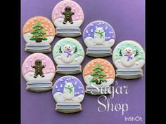 snow globe cookies decorated with frosting and icing on purple background for sugar shop