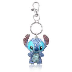 a key chain with an adorable little blue elephant on it's face and eyes