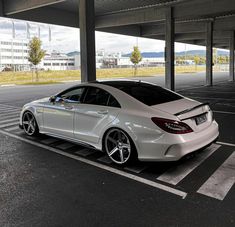 a white car parked in an empty parking lot