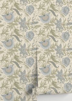 a wallpaper with blue and green birds on it's side, in front of a white background