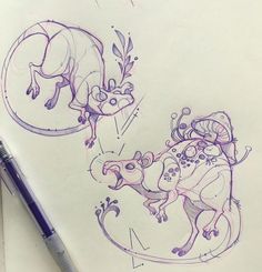 a drawing of a lizard and a mouse on a piece of paper next to a pen