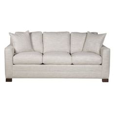 a white couch with pillows on it