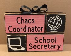 two wooden blocks that say chaos, coordinater and school secretary with a laptop on top