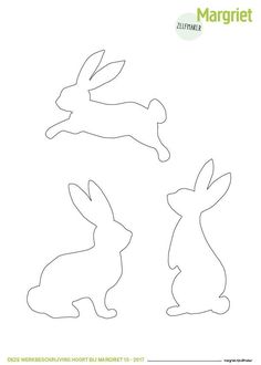 the paper cut out of rabbits is shown in three different sizes and shapes, including one bunny