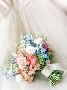 a bridal bouquet is laying on the floor