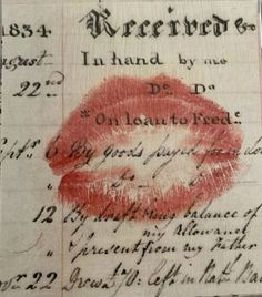 an old document with red lipstick on it