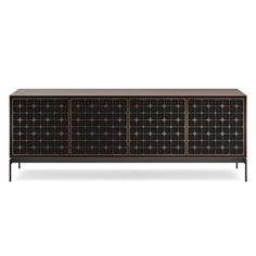 the sideboard is made out of wood and has black metal panels on it, with an intricate design