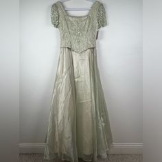 True Vintage Rebecca Ethereal Fairy Sage Green Corset Top Iridescent Skirt Maxi Dress. Size Small. Corset Style Lace Top With Lace Up Tie On The Back. Back Zipper. Short Sleeves. Princess Style Skirt With Three Layers - Iridescent Sheer Fabric On Top, Satin Lining, And Tulle. Fit And Flare Silhouette. Approximate Measurements: Width: 16” Arm Pit To Arm, 14” Waist Flat Lay Length: 44” Waist To Bottom Hem Tags: Wedding * Bridal * Mother Of The Bride * Mother Of The Groom * Bridesmaid * Gala * Even Sage Green Corset Top, Iridescent Skirt, Fairy Corset, Small Corset, Green Corset Top, Ethereal Fairy, Giambattista Valli Dress, Green Corset, Top Satin