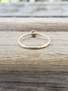 Our stackable 14k Gold Filled ring is amazingly beautiful. It's perfect for stacking or as a simple band. Made with a 4mm Swarovski crystal and gold filled bezel, the ring is roughly 1mm wide and available in the size of your choice. Looking for a different crystal? Let us know. We can customize your order. SIZING: Did you know that ring size changes as your weight changes? Did you lose weight? You may need a smaller size. Have you gained weight? You may need a larger size. It's highly recommend Minimal Engagement Ring, Gold Thumb Rings, Gold Stacking Ring, Weight Changes, Simple Band, Brass Bracelet, Stacked Bangles, Gold Filled Ring, Gold Ring Stack