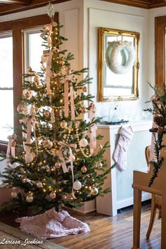 a decorated christmas tree in the corner of a room