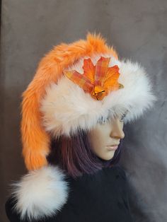 SIZING  Long hats fit 22 to 24 inch heads, short fit average 22 to 23 inches and the LRG is a short hat that fits up to 24 inch heads.    These are a great hat for the beginning of the season in some gorgeous fall colors! The hat is a beautiful tangerine/creamsicle color. The fur has hi and low areas and is a nice thick fur. The brims are a blonde husky faux fur. A creamy white with faint blonde tips. These brims are cut generously so they can be cuffed down. Cuff the brim and then rough the fur Blonde Husky, Long Hats, Blonde Tips, Orange Creamsicle, Creamy White, Santa Hat, Tucson, The Beginning, Fall Colors